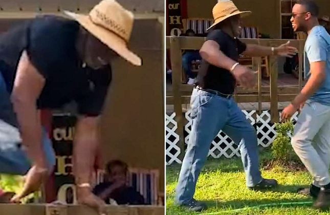 رجل مسن يقفز من فوق سور خشبي