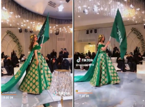 فتاة حسناء ترتدي فستان زفاف باللون الأخضر احتفالًا باليوم الوطني “فيديو”